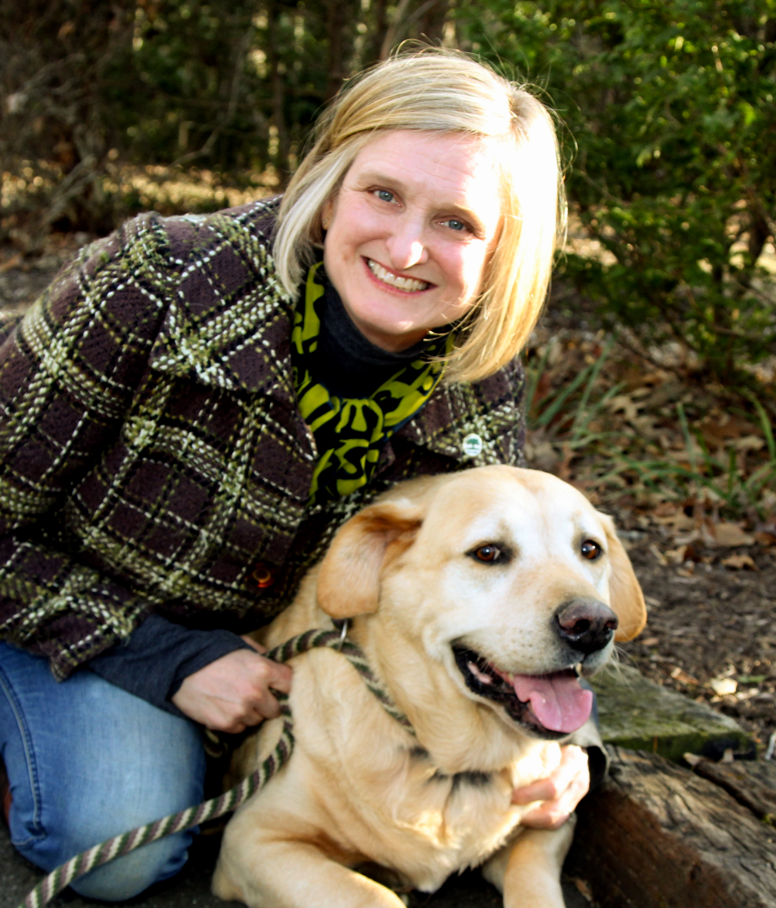 Sara with Bruce one of her nine dogs